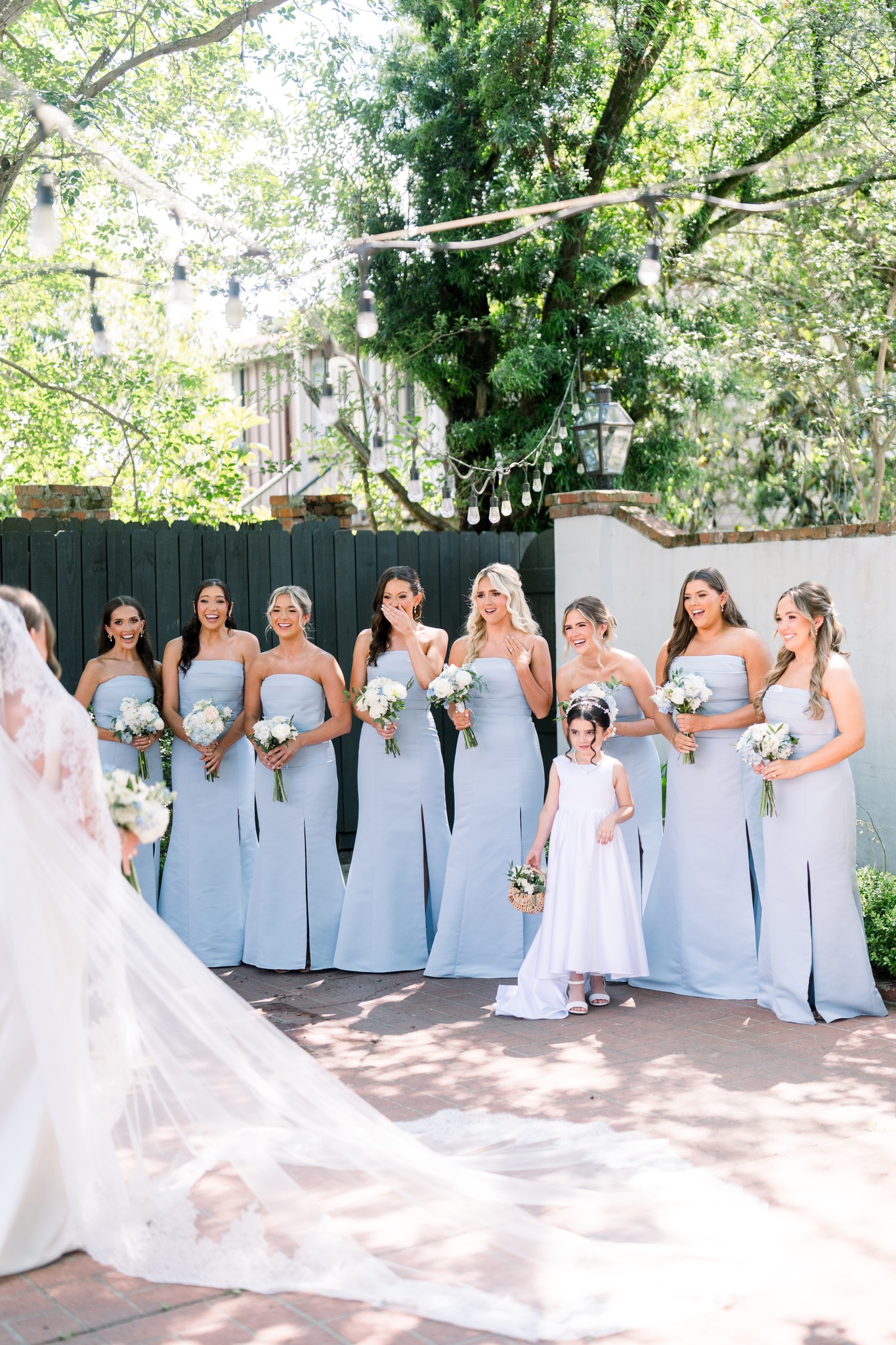 Bridesmaids first look reaction in courtyard at Maison De Tours wedding venue Saint Martinville Louisiana
